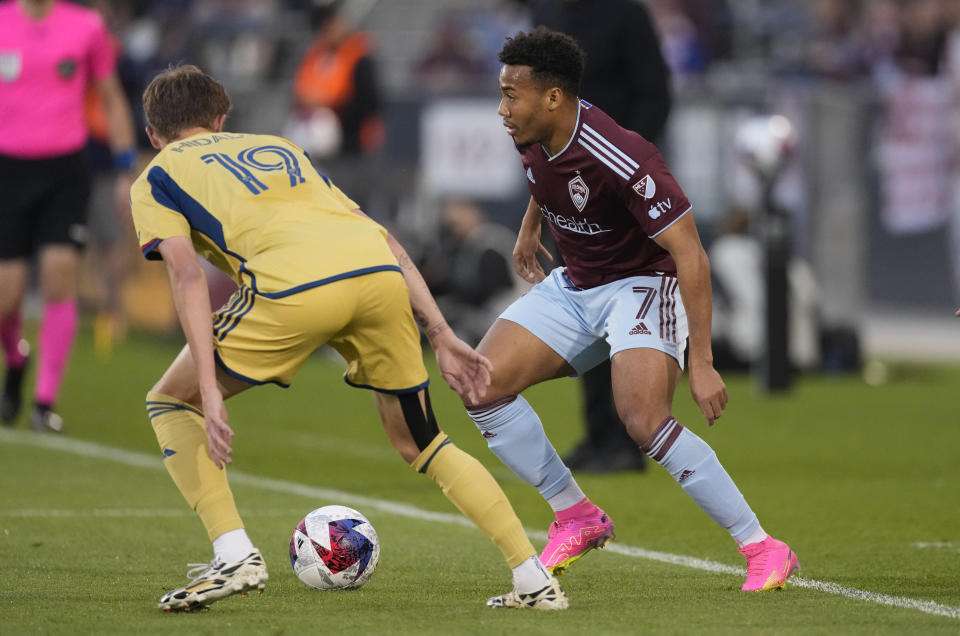 Colorado Rapids forward Jonathan Lewis, right, looks to collect the ball as Real Salt Lake midfielder Bode Hidalgo defends in the first half of an MLS soccer match, Saturday, May 20, 2023, in Commerce City, Colo. (AP Photo/David Zalubowski)