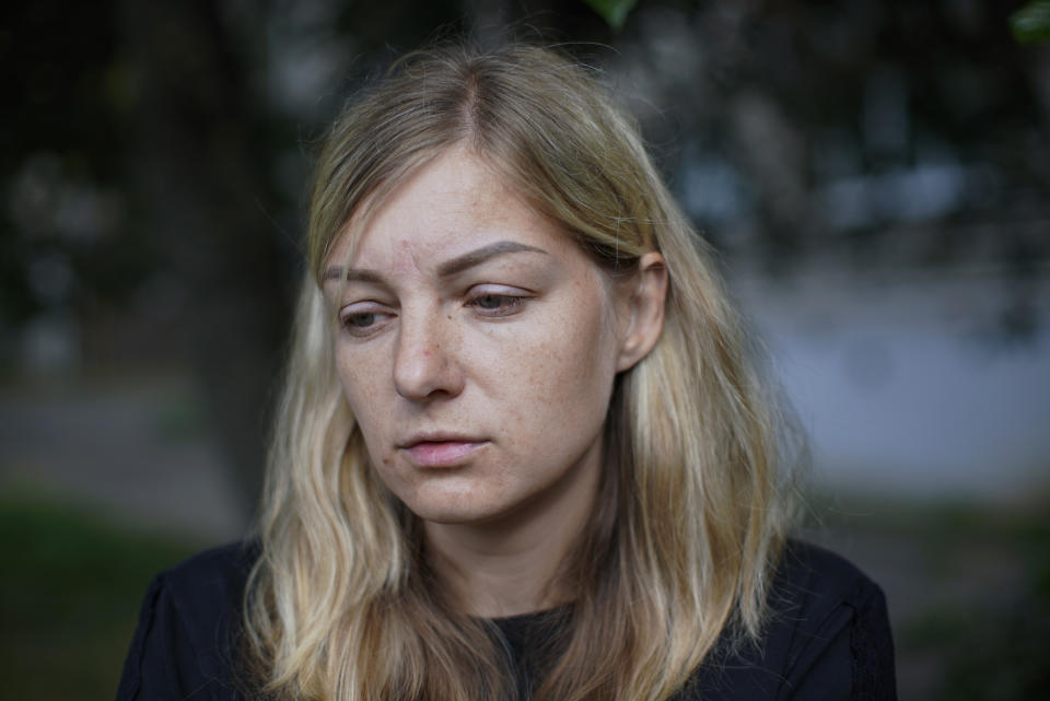 Elena German reacts as she speaks during her interview with the Associated Press in Minsk, Belarus, Saturday, Aug. 15, 2020. Alexander Taraikovsky's life-partner Elena German told The Associated Press on Saturday that she is sure her 34-year-old mate was shot by police. German spoke a few hours before Taraikovsky's funeral and burial, an event that could reinforce the anger of demonstrators who for the past have protested what they consider a sham presidential election and the violent police response to their protests. (AP Photo/Mstyslav Chernov)