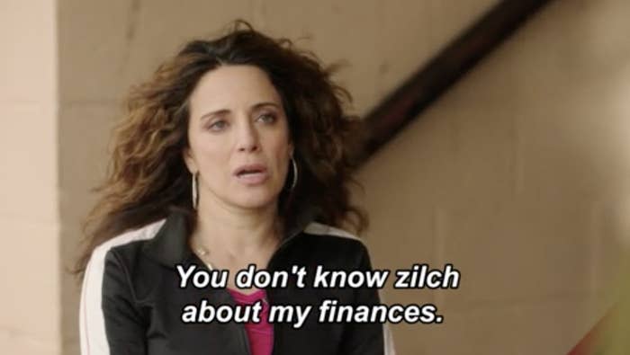 A woman appears distressed during a conversation, on-screen text: "You don't know zilch about my finances."