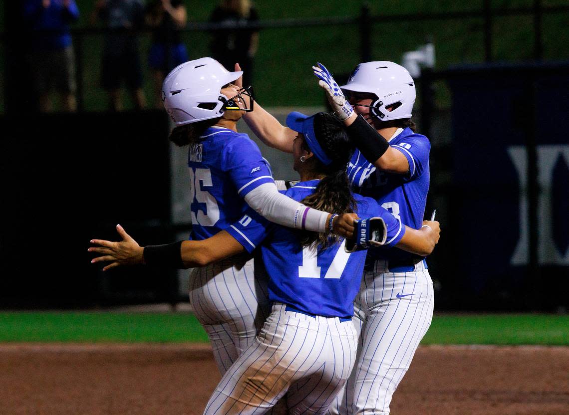 Duke’s Jada Baker, Aminah Vega and Francesca Frelick celebrate after Baker’s sacrifice bunt allowed Frelick to score a walk-off run to cement the Blue Devils’ 1-0 victory over Virginia in 12 innings on Friday, April 19, 2024, in Durham, N.C. Kaitlin McKeown/kmckeown@newsobserver.com