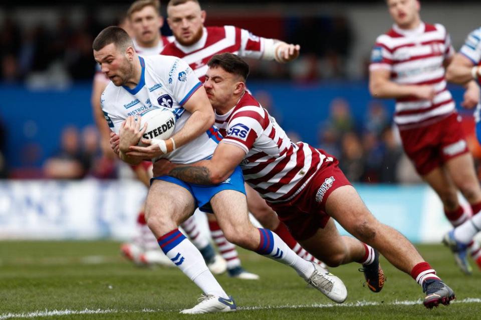 Wakefield’s Max Jowitt is tackled during their Challenge Cup quarter-final against Wigan.