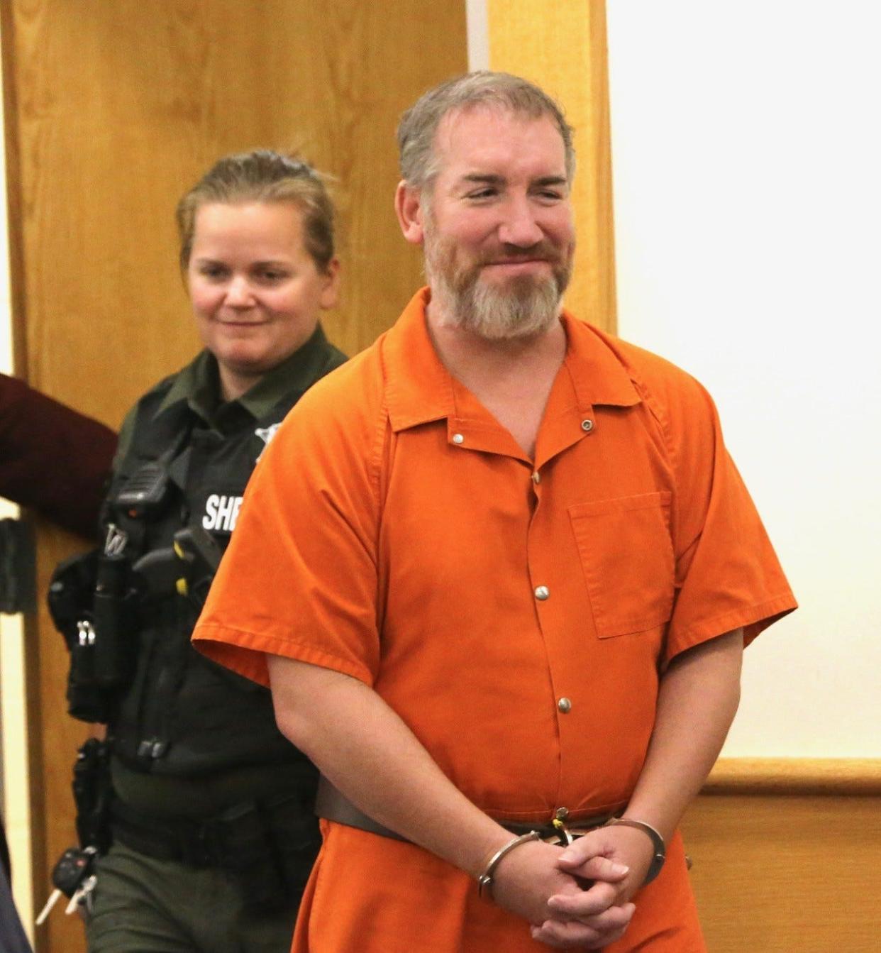 Harry Wallus, a former Portsmouth physician and part-time Greenland police officer, was sentenced to 9 months in jail Friday for assaulting his girlfriend. He is pictured in court Sept. 13 when his sentencing was originally scheduled but continued to Nov. 3.