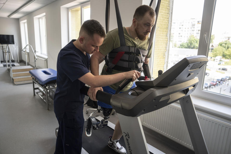 Mykhailo Yurchuk, a former Ukrainian paratrooper of the 95th brigade, learns to run on his prosthetic leg at the Unbroken rehabilitation center in Lviv, Ukraine, Wednesday, Aug. 23, 2023. Yurchuk has himself become the chief motivator for new arrivals from the front, pushing them as they heal from their wounds and teaching them as they learn to live and move with their new disabilities. Ukraine is facing the prospect of a future with upwards of 20,000 amputees, many of them soldiers who are also suffering psychological trauma from their time at the front. (AP Photo/Evgeniy Maloletka)