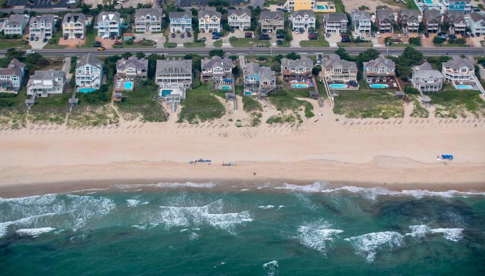 NC 12 runs through the densely developed beach front area of Nags Head, N.C. on Wednesday, July 21, 2021. Many of the large ocean front vacation homes feature their own swimming pools.