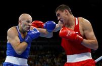 2016 Rio Olympics - Boxing - Final - Men's Heavy (91kg) Final Bout 220 - Riocentro - Pavilion 6 - Rio de Janeiro, Brazil - 15/08/2016. Evgeny Tishchenko (RUS) of Russia and Vassiliy Levit (KAZ) of Kazakhstan compete. REUTERS/Peter Cziborra