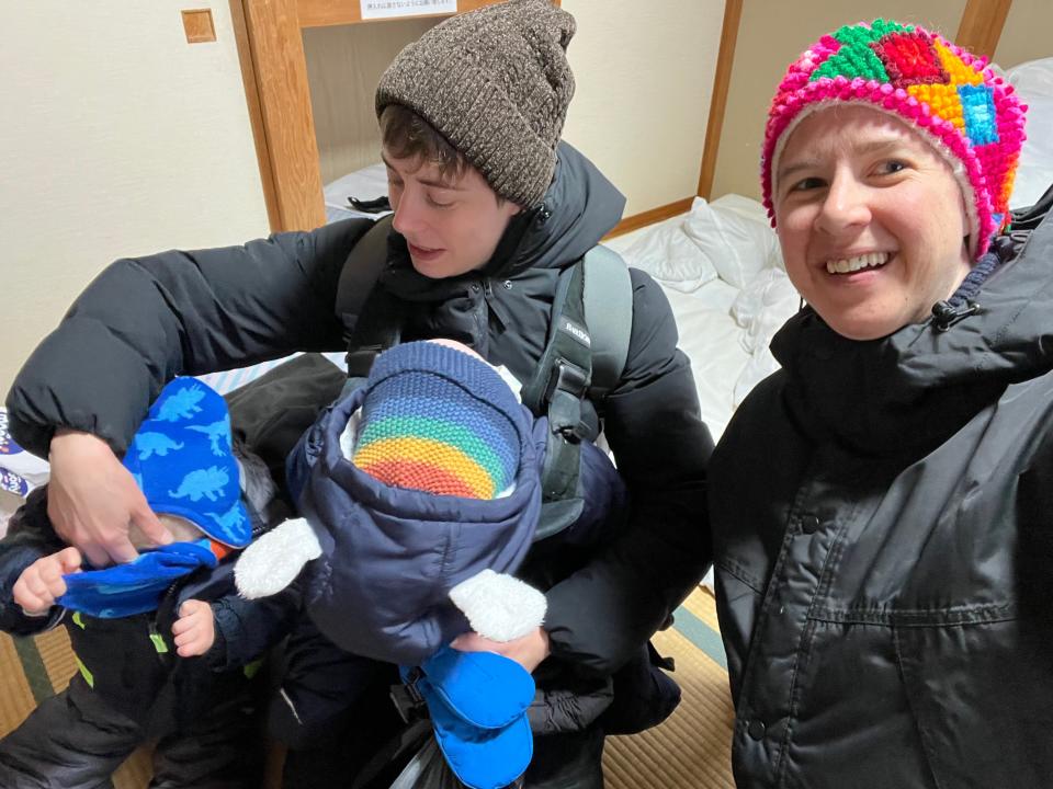 Couple in winter clothes and two children in a Japanese inn