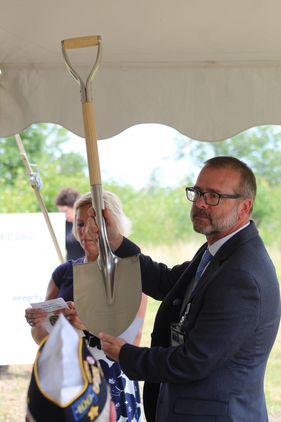 VA Medical Center Director Chris Cauley presents a ceremonial shovel during a groundbreaking ceremony on the new CBOC in Indian River.