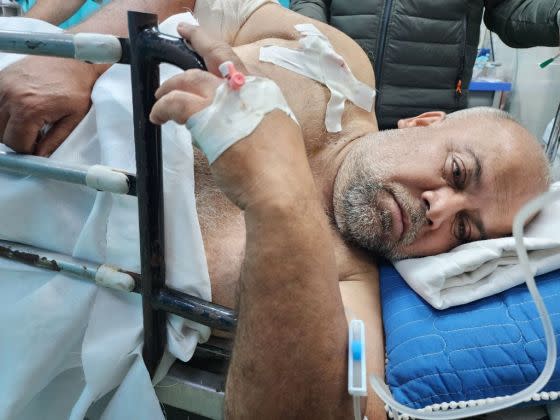 Al Jazeera correspondent Wael Al-Dahdouh receives medical treatment at Nasser Hospital after being wounded in Khan Yunis, Gaza on December 15, 2023.<span class="copyright">Hani Alshaer—Anadolu/Getty Images</span>