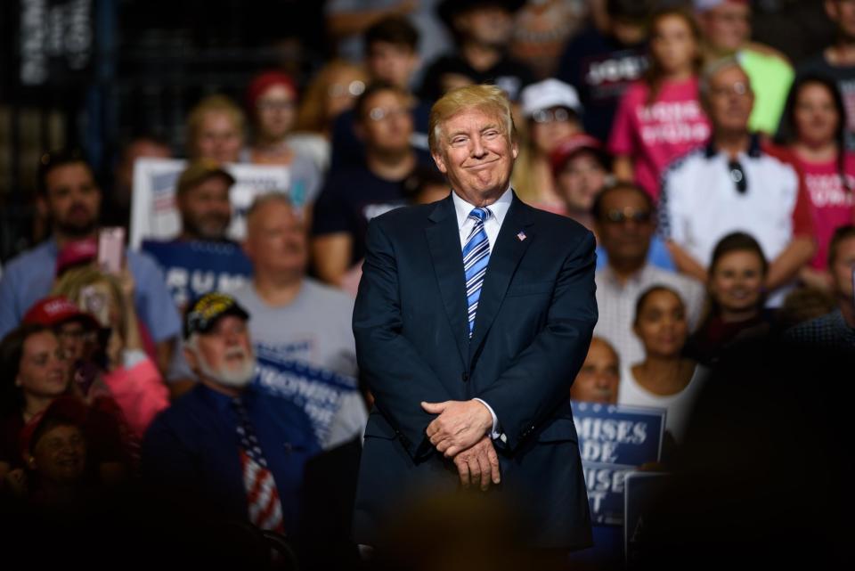 President Donald Trump listens to West Virginia Governor Jim Justice speak at the President's campaign rally: Justin Merriman/Getty Images