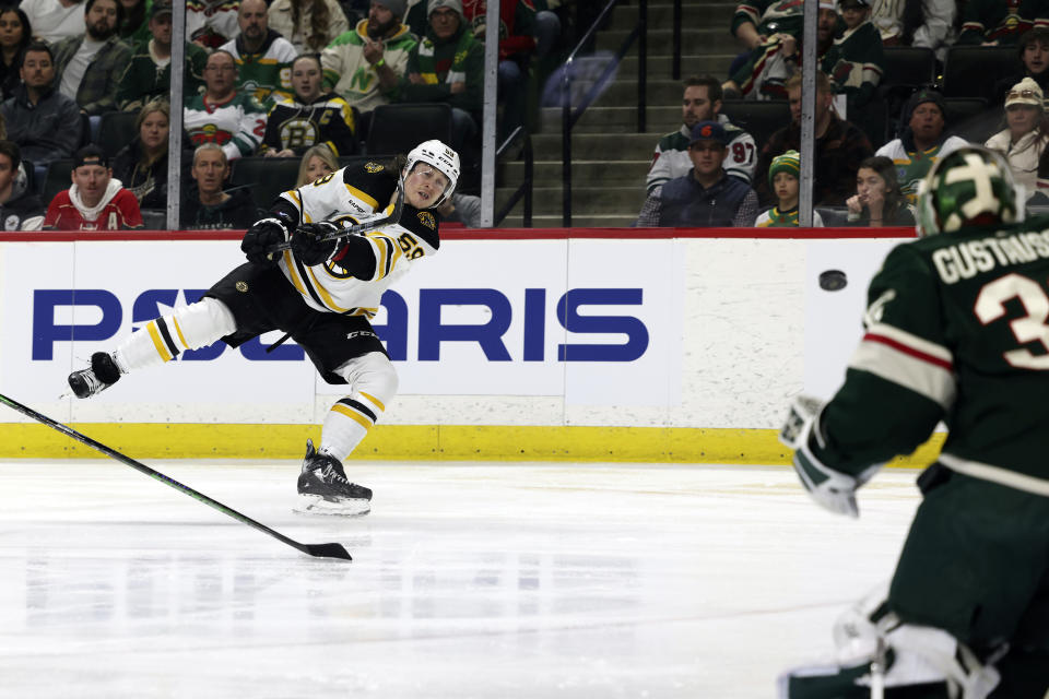 Boston Bruins left wing Tyler Bertuzzi (59) tries to a make a goal against Minnesota Wild goaltender Filip Gustavsson (32) during the second period of an NHL hockey game Sunday, March 18, 2023, in St. Paul, Minn. (AP Photo/Stacy Bengs)