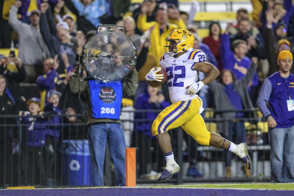 LSU running back Clyde Edwards-Helaire (22) runs for a touchdown against Arkansas during the second half of an NCAA college football game in Baton Rouge, La., Saturday, Nov. 23, 2019. (AP Photo/Matthew Hinton)