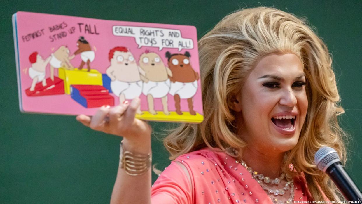 Drag queen with a book