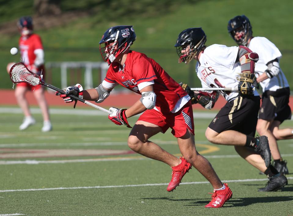 Stepinac's Aidan Bross (3) controls a pass and heads to the goal against Iona Prep during boys lacrosse action at Iona Prep in New Rochelle April 18, 2023. Stepinac won the game 9-7.