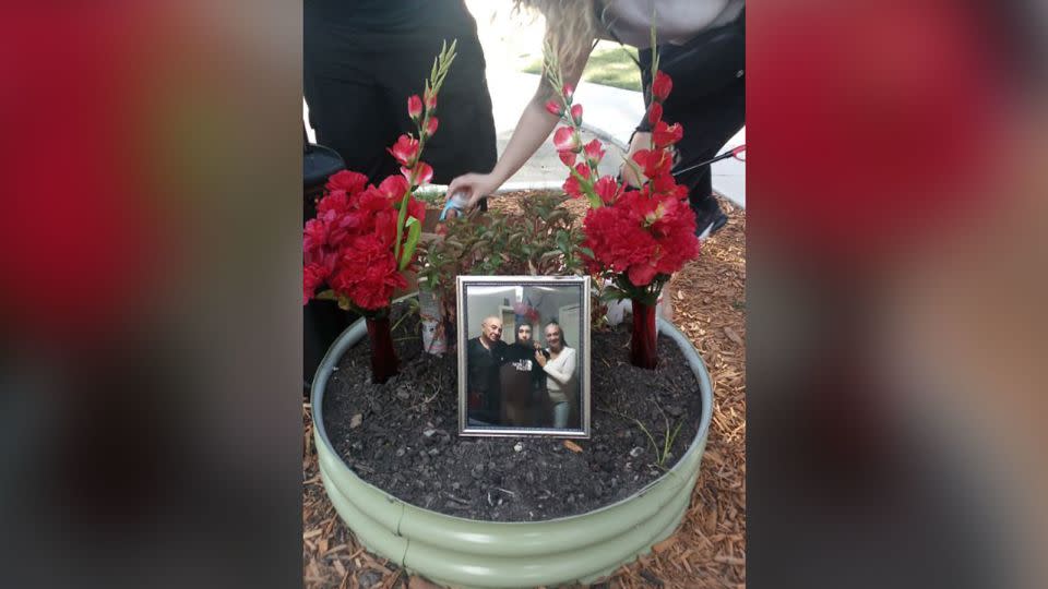 A memorial sits on the stoop where Raul Rios used to hang out, listening to music and playing with the neighborhood children. - Courtesy Elizabeth Callie Ann Smith