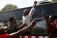 <p>Supporters of Kenyan opposition leader Raila Odinga of the National Super Alliance (NASA) coalition gesture through a bus window ahead of his planned swearing-in ceremony as the President of the People’s Assembly in Nairobi, Kenya, Jan. 30, 2018. (Photo: Baz Ratner/Reuters) </p>