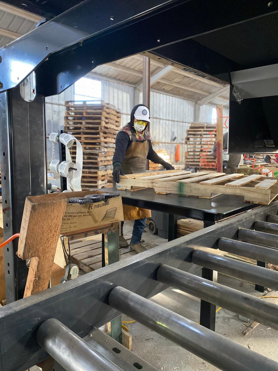 Venancio Anastacio works on pallets at Oxnard Pallet Co. The company is one of three local businesses to get a low-interest loan through a county program that promotes recycling and reuse.