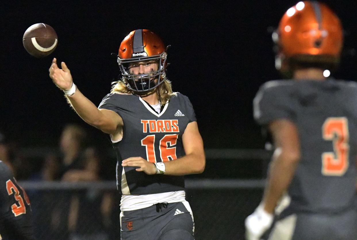 Tocoi Creek quarterback Ryan Killmer (16) aims a pass toward receiver Julio Santiago.