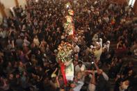 File - In this Tuesday Nov. 2, 2010 file photo, mourners carry the coffins of slain Christians during their funeral in Baghdad, Iraq, who were killed Sunday when gunmen stormed a church during mass and took the entire congregation hostage. The attack, claimed by an al-Qaida-linked organization, was the deadliest recorded against Iraq's Christians since the 2003 U.S.-led invasion unleashed a wave of violence against them. (AP Photo/Khalid Mohammed, File)