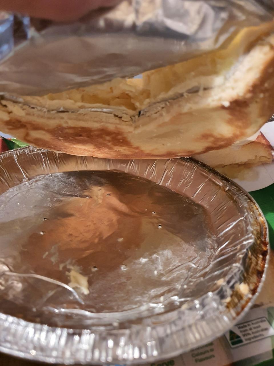 A layer of aluminium foil squished into the pie. 