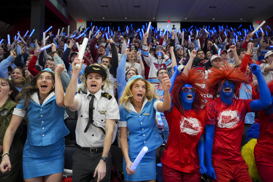 Students cheer before an NCAA college basketball game between Rhode Island and Dayton, Saturday, Jan. 20, 2024, in Dayton, Ohio. (AP Photo/Aaron Doster)