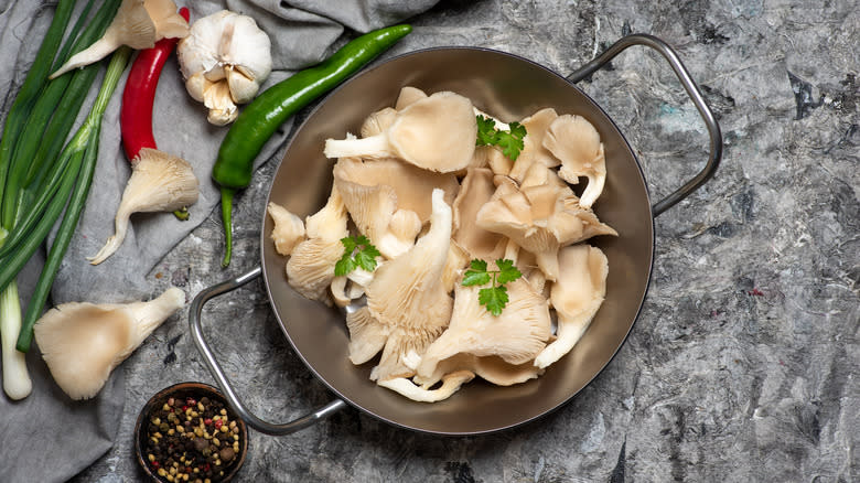 Oyster mushrooms crowded in pan