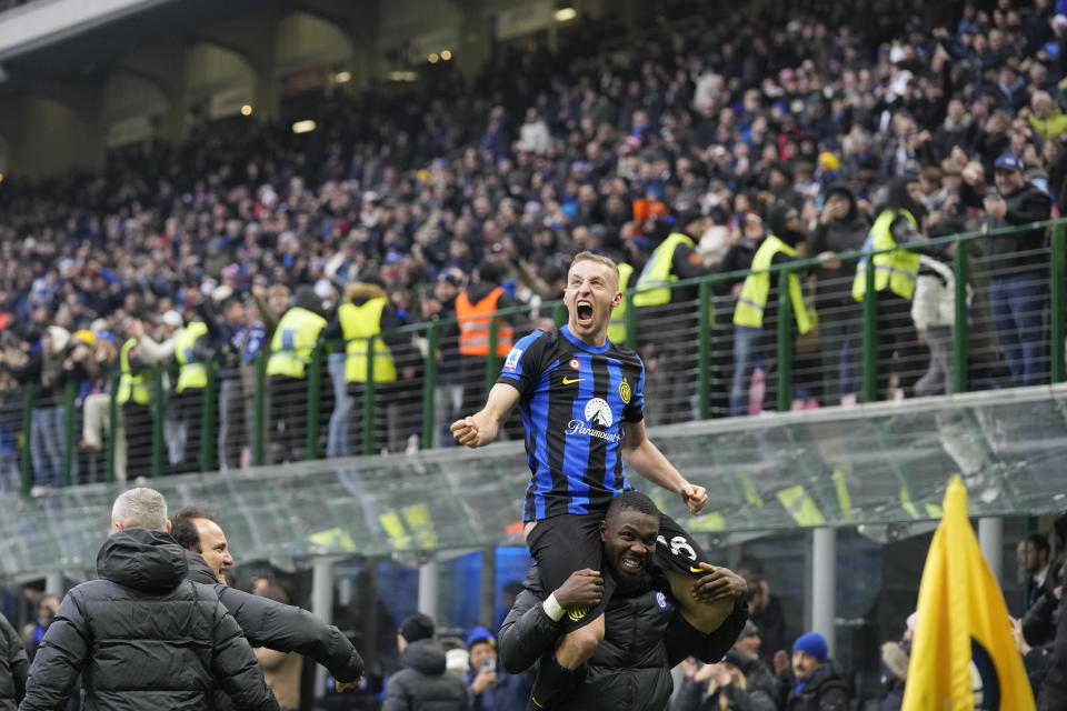 Inter Milan's Davide Frattesi, top, celebrates after scoring his side's second goal during the Serie A soccer match between Inter Milan and Hellas Verona at the San Siro Stadium in Milan, Italy, Saturday, Jan. 6, 2024. (AP Photo/Antonio Calanni)