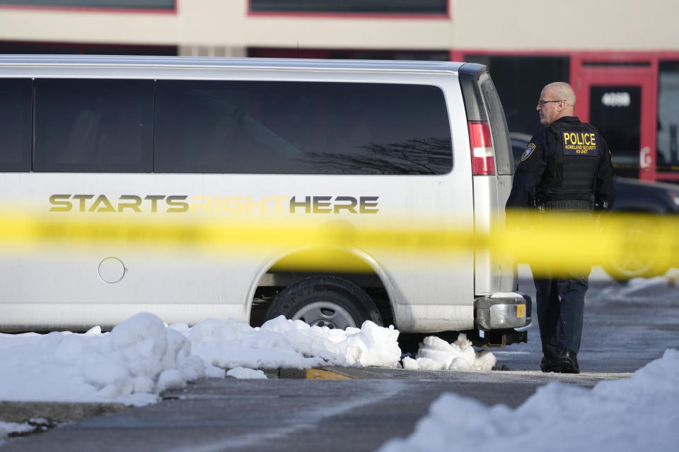 FILE - A law enforcement officer walks outside the Starts Right Here building, Jan. 23, 2023, in Des Moines, Iowa. On Friday, Feb. 3, 2023, Will Keeps, founder of the Starts Right Here program for at-risk youth in Des Moines, said he will remain “all in on helping kids that are not reachable in so many peoples' eyes” after he was wounded in last month's shooting that killed two of his students. (AP Photo/Charlie Neibergall, File)