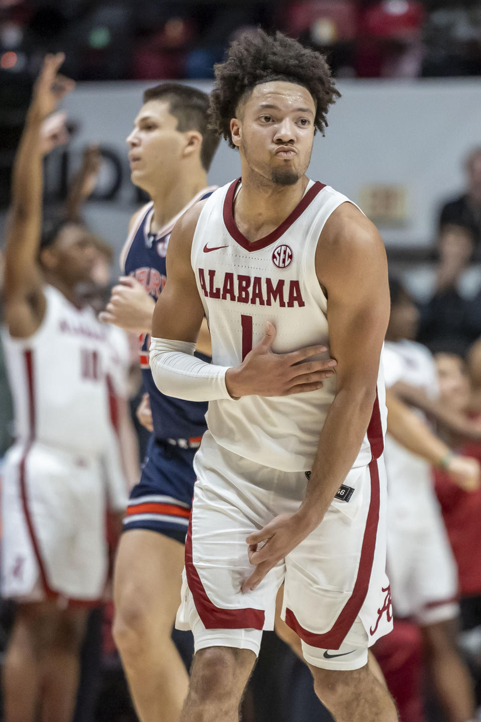 Alabama guard Mark Sears (1) celebrates a 3-point shot during the second half of the team's NCAA college basketball game against Auburn, Wednesday, Jan. 24, 2024, in Tuscaloosa, Ala. (AP Photo/Vasha Hunt)