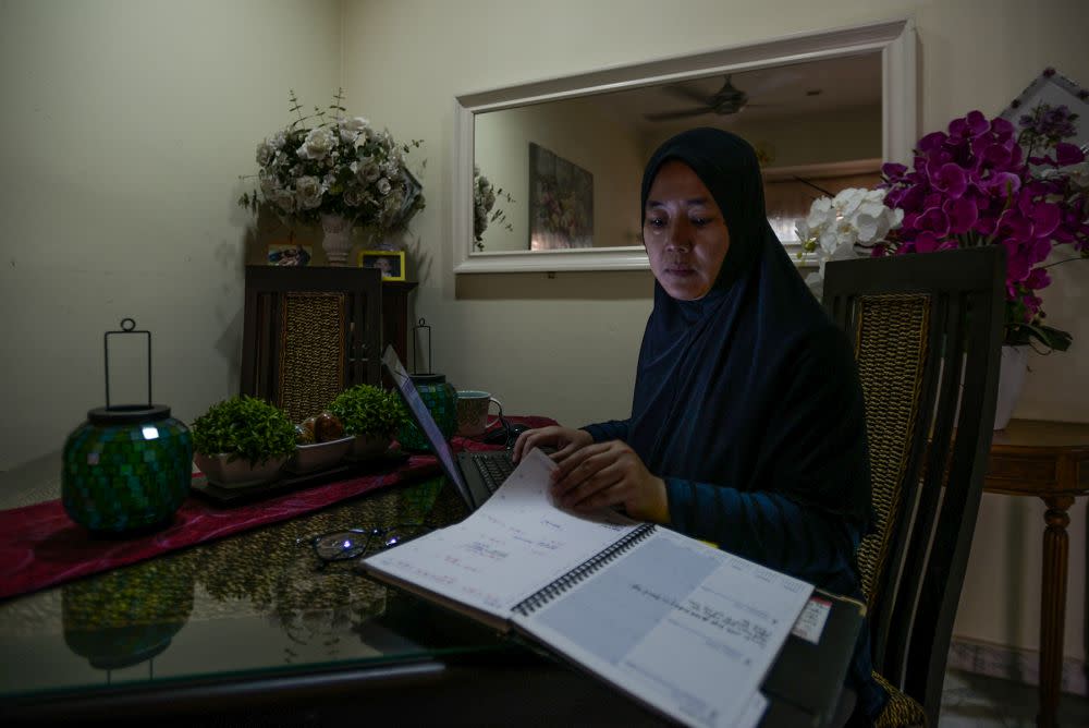 A woman works from the comfort of home in Shah Alam April 15, 2020. — Picture by Miera Zulyana