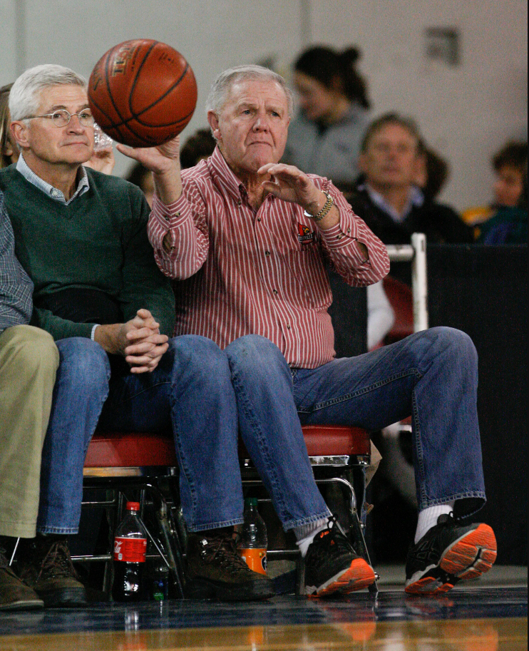 Former U of L head basketball coach Denny Crum caught a loose ball that went out of bounds during the St. X-Trinity basketball game at Broadbent Arena. Jan. 6, 2017