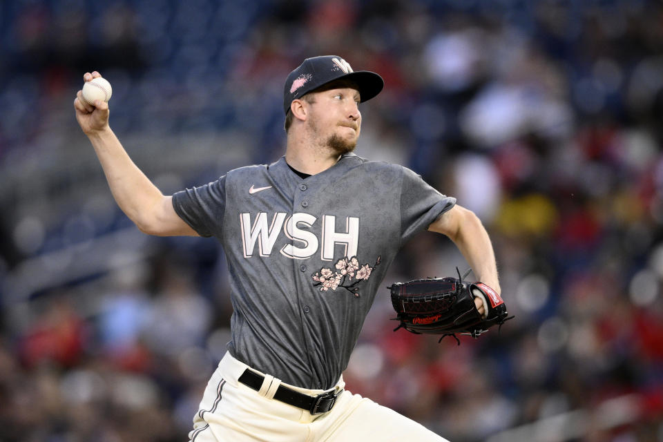 Washington Nationals starting pitcher Erick Fedde throws during the third inning of the team's baseball game against the Houston Astros, Saturday, May 14, 2022, in Washington. (AP Photo/Nick Wass)