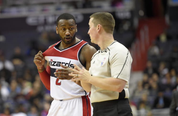 John Wall can't believe the Wizards lost either. (Associated Press)