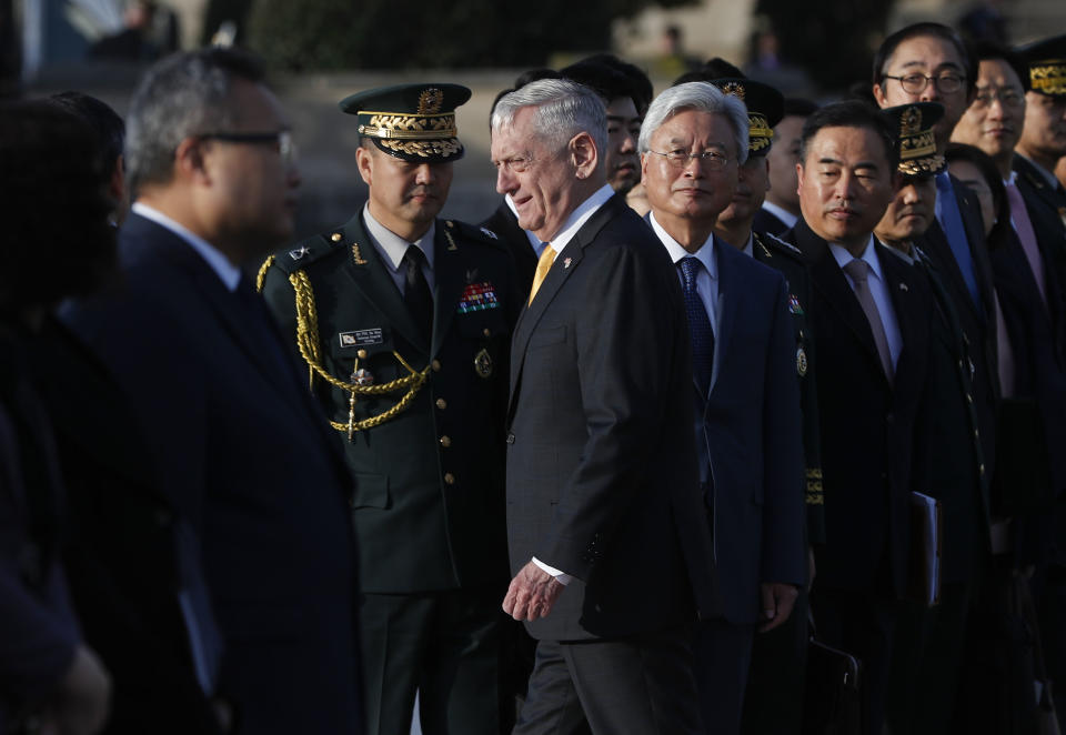 Defense Secretary Jim Mattis, center, walks past members of the South Korean delegation as he co-host the 2018 Security Consultative, with South Korea Minister of Defense Jeong Kyeong-doo, at the Pentagon, Wednesday, Oct. 31, 2018. (AP Photo/Pablo Martinez Monsivais)