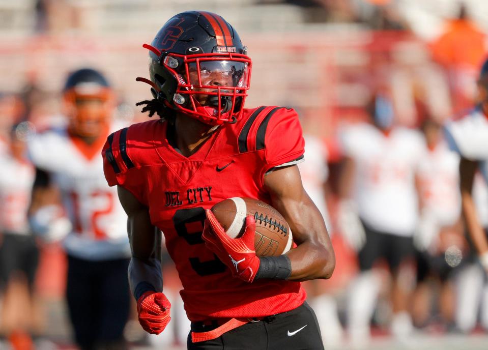 Del City's LaDainian Fields scores a touchdown during the high school football game between Del City and Booker T. Washington at Del City High School in Del City, Okla., Thursday, Aug., 31, 2023.