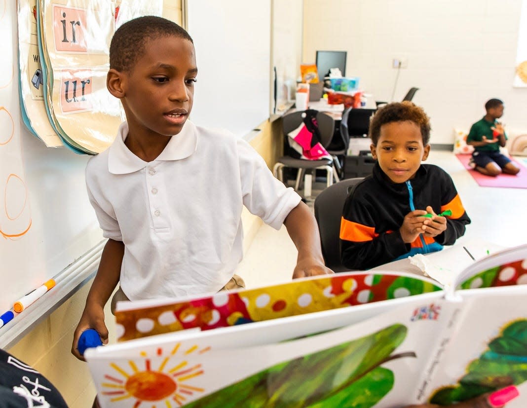 Students at A.B. Williams Elementary School take in the story of "The Very Hungry Caterpillar" during a Looping Literacy Together lesson with Loop It Up Savannah.