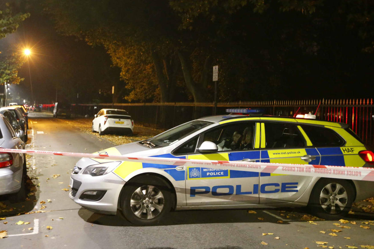 Police at the scene where a man was stabbed to death in East Ham: Nigel Howard