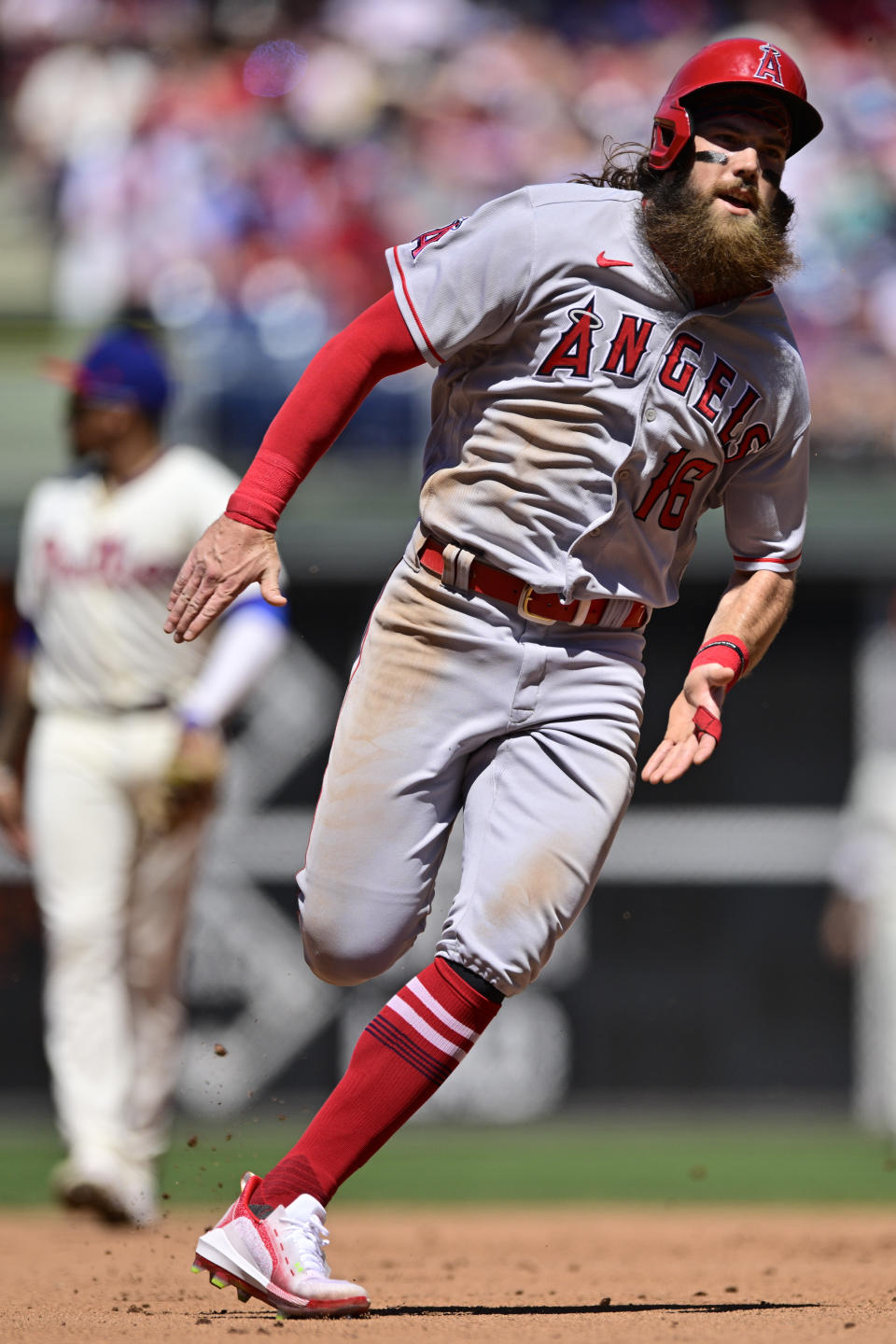 Los Angeles Angels' Brandon Marsh runs to third base after a hit by Kurt Suzuki off Philadelphia Phillies starting pitcher Kyle Gibson during the fourth inning of a baseball game, Sunday, June 5, 2022, in Philadelphia. (AP Photo/Derik Hamilton)