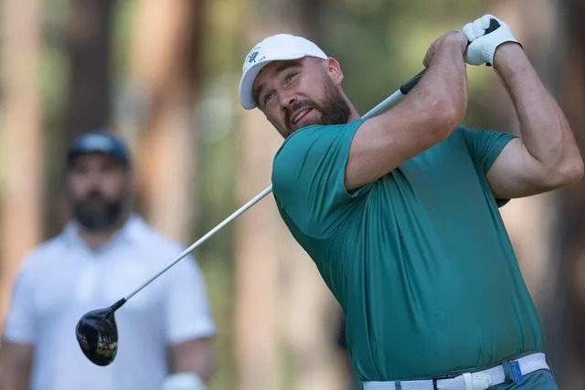 <p>David Calvert/Getty</p> Travis Kelce swings during the American Century Championship on July 12, 2024