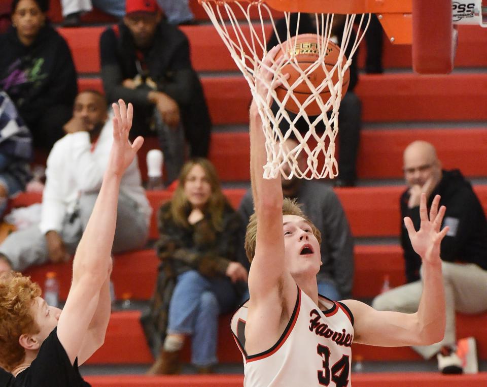 Fairview junior Archie Murphey, right, scores in the first half against Meadville in Fairview Township on Dec. 9.