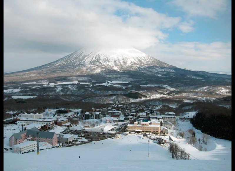 Niseko means "a cliff jutting over a riverbank deep in the mountains." Sounds scary, right? The recipient of weather patterns from Siberia, Niseko gets about 50 feet of snow each year (Mount Yōtei is pictured).    <em>iStockPhoto</em>