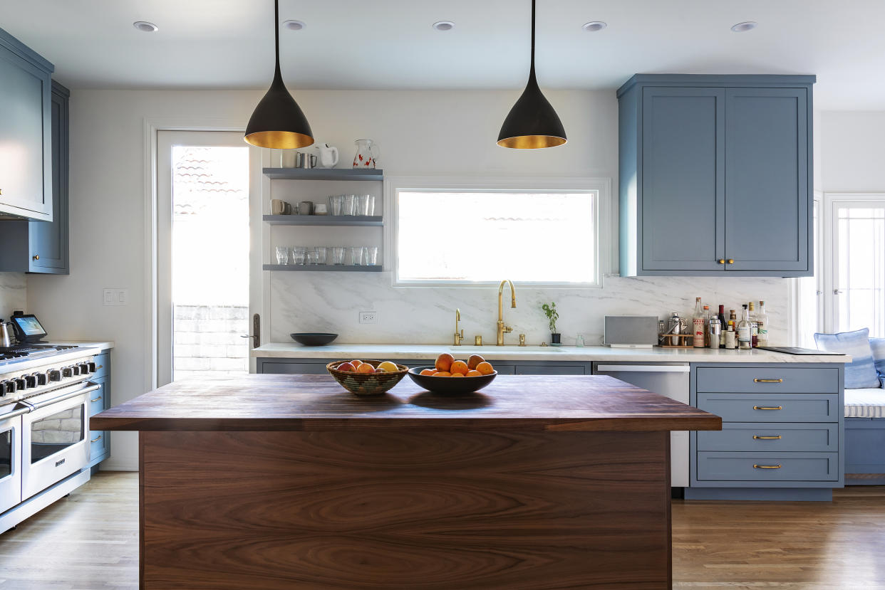  A kitchen with a butcher's block. 