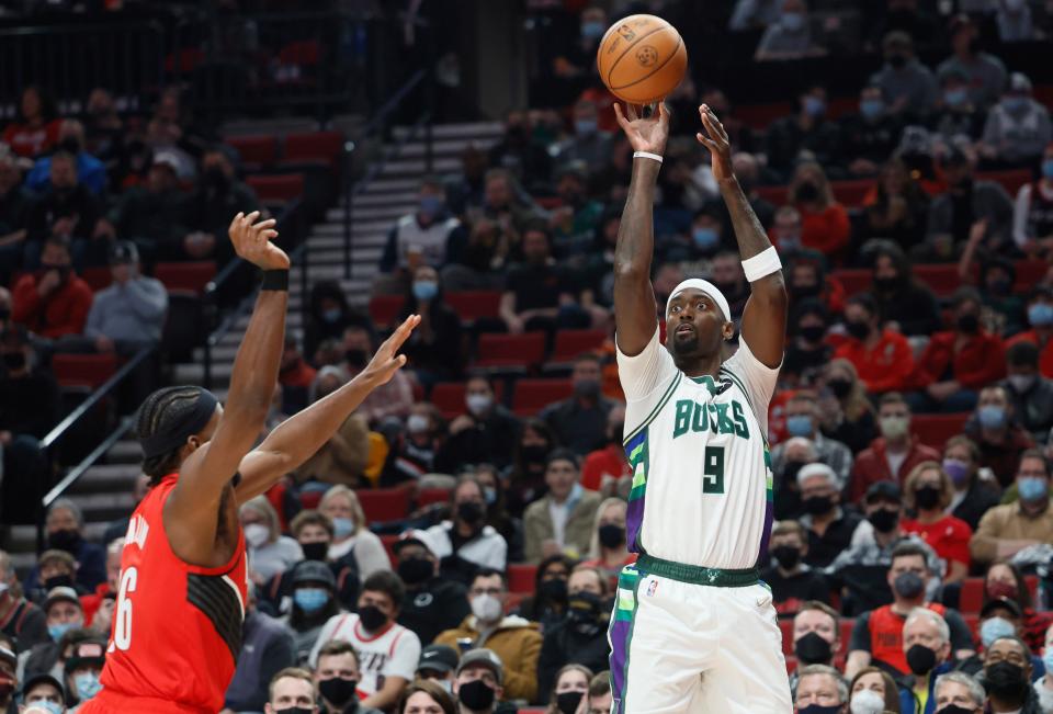 Bucks center Bobby Portis shoots over Trail Blazers forward Justise Winslow on Saturday night in Portland. Portis had 30 points.