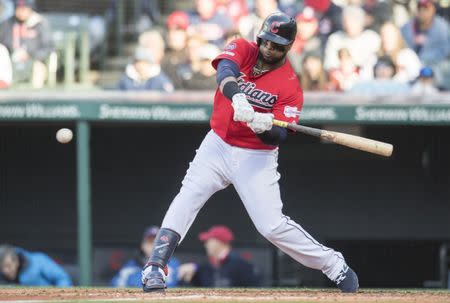 Apr 1, 2019; Cleveland, OH, USA; Cleveland Indians first baseman Carlos Santana (41) hits an RBI single during the sixth inning against the Chicago White Sox at Progressive Field. Mandatory Credit: Ken Blaze-USA TODAY Sports