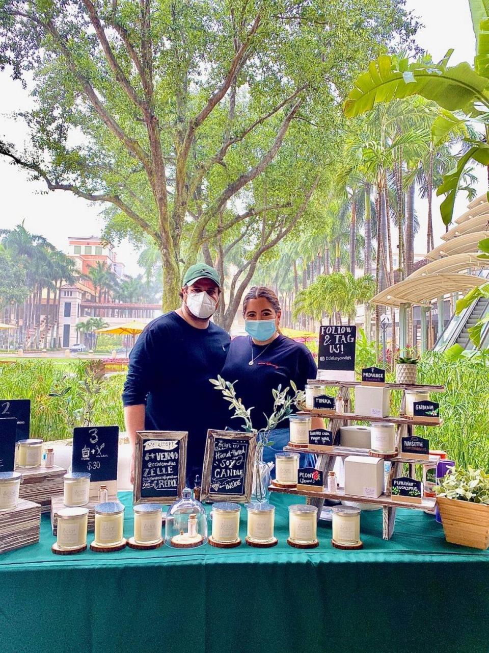 Joel and Tere Ceballos, owners of Éclat Soy Candles, created a new way for customers to smell their candle scents at the Sunday Farmers Market at Shops of Merrick Park amid the pandemic.