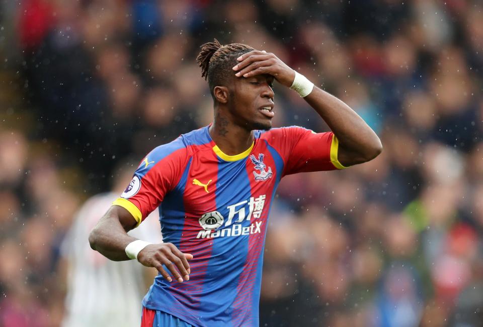 Zaha is currently being assessed by Palace's medical staff: Getty Images