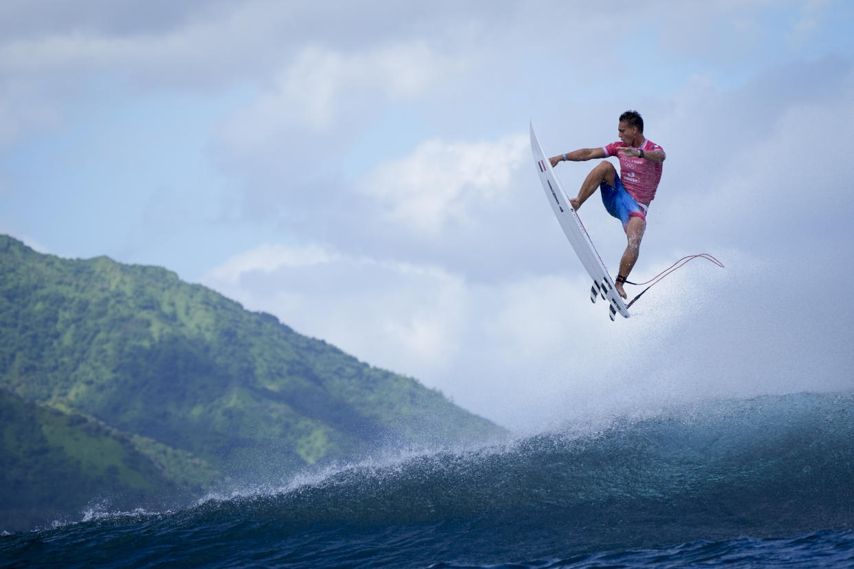 Kauli Vaast, of France, leaps over a wave during the second round of the 2024 Summer Olympics surfing competition in Teahupo'o, Tahiti.