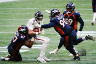 Denver Broncos' DeMarcus Walker (57) and defensive end DeShawn Williams (90) sack Atlanta Falcons quarterback Matt Ryan (2) during the second half of an NFL football game, Sunday, Nov. 8, 2020, in Atlanta. (AP Photo/Brynn Anderson)