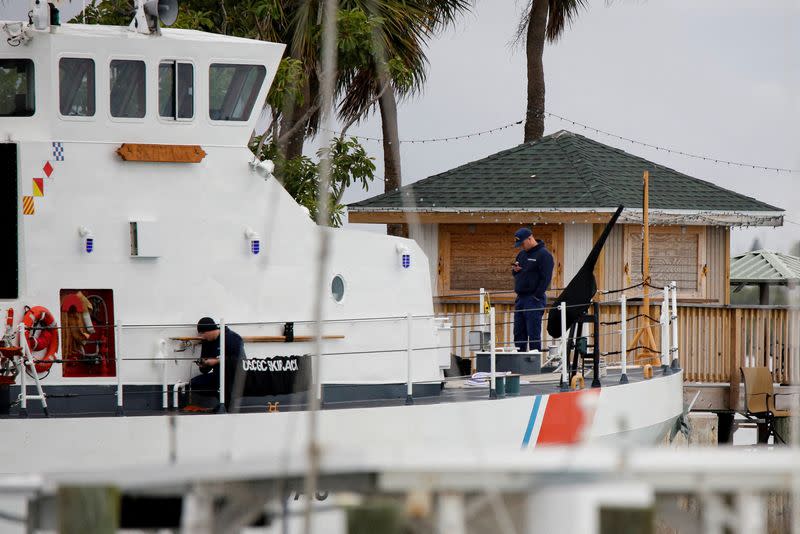 Members of the crew are seen onboard the U.S. Coast Guard Cutter Skipjack docked at the U.S. Coast Guard station, in Fort Pierce