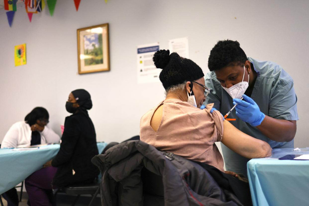 Elizabeth Griffin, 86, is given her first dose of the Moderna coronavirus (COVID-19) vaccine by Anya Harris at Red Hook Neighborhood Senior Center.