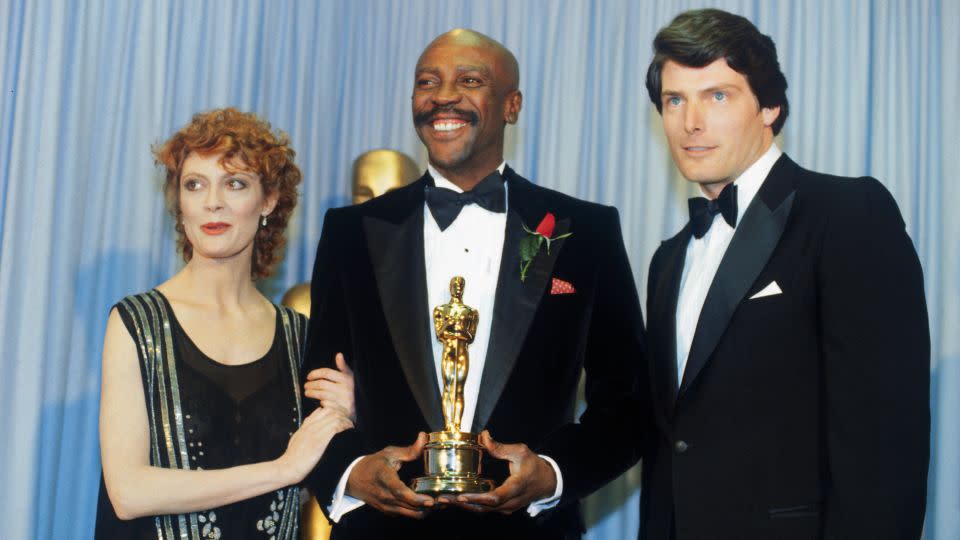 Susan Sarandon and Christopher Reeves flank Louis Gossett Jr., winner of the 1982 Academy Award for best supporting actor for his role in "An Officer and a Gentleman." - Bettmann Archive/Getty Images
